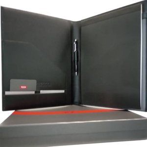 Tumi Nassau Letter Pad  with "Nespresso" imprint on the leather and a pen